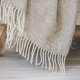 Wool blanket with fringes "Juostelės" beige